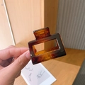 Amber brown square hair claw clip with a glossy translucent finish in a large size - Amber