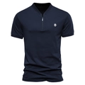 Detail of navy blue polo shirt with zip V-neck and white embroidered lion head logo - S / Navy Blue