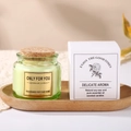 Green glass scented soy candle with cork lid and elegant floral gift box packaging - Deep Green Misty Forest