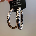 Detail of vintage leopard print hoop earrings made of 925 silver with retro animal pattern - Leopard Circles / Classic Brown Leopard (925 Silver Earring Post)
