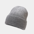 Macro detail of the grey ribbed knit texture and folded cuff on this warm winter beanie - One Size / Gray