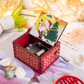 Detail of red wooden hand-crank music box with golden patterns and Santa Claus illustration - Christmas 21/Red/Santa Snowman Illustration 2