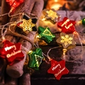 Star-shaped Christmas LED string lights with red, green, and gold festive ornaments - Christmas Star 1.5m 10 LEDs Battery Operated