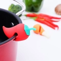 Silicone red chili-shaped lid lifter prevents boiling over in a kitchen pot - Little Pepper / Red