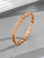 Macro detail of rose gold daisy bracelet with crystal centers and polished steel finish - Daisy / Rose Gold