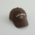 Detailed close-up of dark brown cotton baseball cap with Luckbear embroidery and star patch - 50-52cm 1-5 Years / Brown