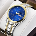 Close-up of blue dial quartz watch with luminous hands and day-date display - Two-tone Gold & Silver with Blue Dial