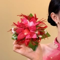 Detailed close-up view of a sweet fabric orchid flower hair clip with elegant pink design. - Single Duckbill Clip / Red Green
