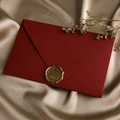 Detail of a deep red linen textured envelope with a golden For You wax seal on silk - 1pc Linen Deep Red Envelope + Wax Seal / Dark Red