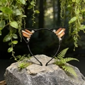 Macro shot of orange aura quartz crystals and small rhinestones on a black cat ear headband - Brown Cat Ears
