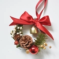 Christmas wreath ornament with pine cones, red bow, golden bell, and white berries - Red Bow Wreath 13cm