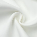 Close-up of white twill fabric texture with soft glossy finish on a lace blazer - XS / Black