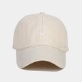 Close-up of cream baseball cap with white embroidered smiley face and cotton twill texture - Adjustable / Beige