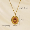 Dettaglio della collana a sfere dorate con pendente ovale rosso e stella d'oro - Rodocrosite Ovale