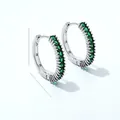 Detailed close-up of silver hoop earrings with rectangular emerald green cubic zirconia - Green Zirconia