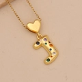 Detailed close-up of gold J-letter pendant with heart link and colorful cubic zirconia - Letter J / Gold