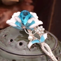 Rose gold hair pin featuring a large blue teardrop gem and white enamel petals - Rose Gold Blue Water Drop Gem White Enamel Flower (FZ034)