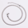 Detailed macro view of silver flat snake chain with lobster clasp and extender - Steel Color Wave Textured