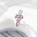 Silver fork-shaped earring with a bow, clear zircon, and pink heart zircon charm - Left Side (A423)