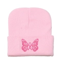 Close-up of pink knit beanie featuring detailed butterfly and pink ribbon embroidery - M (56-58cm) / Pink