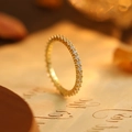 Slim gold eternity band with sparkling cubic zirconia stones set on vintage paper - US 6 / Gold