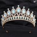 Detailed macro view of mint green crystals and white rhinestones on a gold bridal crown - H1221 KC Gold + Green Opal