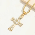 Macro shot of gold cross pendant with white enamel and sparkling rhinestones - White Enamel
