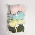 Set of four colorful flocked Easter bunnies in pink blue yellow and green gift bags - Green 4-Pack