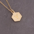 Detailed macro of gold hexagonal necklace featuring embossed letter Y on textured background - Letter Y (25#Y)