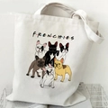 Beige canvas French Bulldog tote bag with colorful dog illustrations and text in a wire basket - Frenchies Friends Logo (I)
