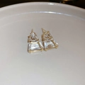 Minimalist geometric S925 earrings with gold frames and clear crystals on a ceramic dish - Gold Transparent Trapezoidal Stud Style (131#)