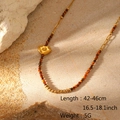 Detail of bohemian stone beaded necklace with gold heart pendant and size specifications - Hammered Heart Pattern (LC40058)