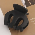 Detailed close-up of a black matte pumpkin claw clip showing textured interlocking teeth - 9# Matte Classic Black