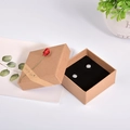 Kraft jewelry gift box with red rose decoration containing square silver stud earrings - 7.3x7.3x3.3cm