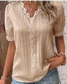 Detail of V-neckline with delicate white lace trim on champagne pleated fabric - S / Apricot