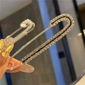 Macro shot of silver safety pin brooch with rhinestones for waist adjustment - Silver Decor Pin with Hanging Loop (7.5cm)