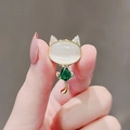 Elegant gold cat brooch with white opal head and green teardrop gemstone accent - No. 51 Cat