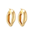 Macro shot of 18K gold plated twisted oval earrings with a polished mirror finish - Irregular Oval Hoop / Gold