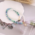 Detail of bohemian double-layer necklace with pearls, clay beads, and golden star pendant - Blue & Green Discs Sun & Star Style (5#)