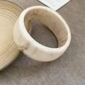 Chic cream acrylic bangle with brown marble pattern in a minimalist round geometric design - Beige (Standard)