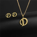 Detailed view of golden stainless steel necklace and earrings set with letter D pendant - Letter D / Gold