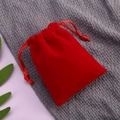 Red velvet drawstring jewelry pouch for small gifts shown in a high-quality top view - 5*7cm / Red