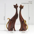 Pair of modern resin cat figurines with dark wood grain finish and gold tail accents - KY143 Wood Grain