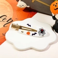 Close-up of Halloween duckbill hair clips with pumpkin and spider web motifs - Off White Spider Bat