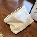 Cream canvas travel cosmetic bag with elegant butterfly embroidery and zipper closure - White Bow