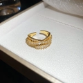 Macro shot of double row zircon gold ring in a white velvet box with sharp details - Gold Double Row Zirconia Cross Open Ring / Gold