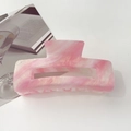 Close-up of pink iridescent marble textured hair claw clip on a minimalist background - 10.5cm Rectangular / Starry Pink