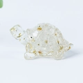 Clear natural crystal turtle figurine with gold foil flakes on white background - 04 Clear Quartz + Gold Foil