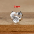 Macro view of a 7mm heart-shaped clear zircon earring with silver four-prong setting - 7mm Silver Tone White Style (E1611)