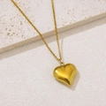 Minimalist polished gold heart pendant necklace on aesthetic stone background - 3D Puffy Heart (NKS-002_08)
